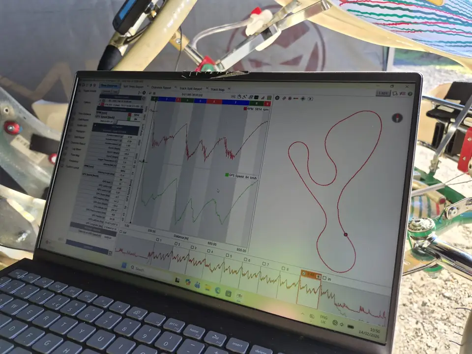 MyChron data on a laptop screen showing engine speed, kart speed and the track map